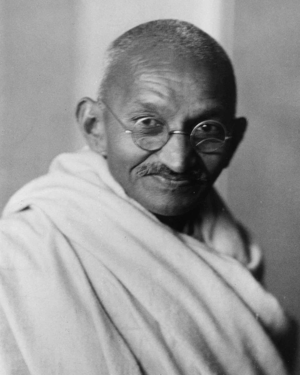 Mahatma Gandhi wearing glasses and a shawl