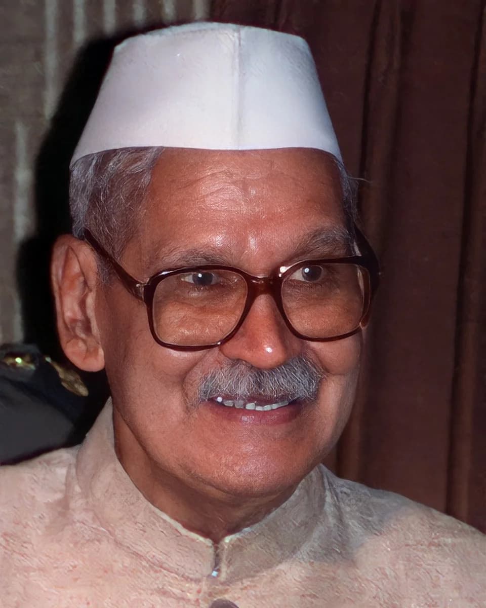 Shankar Dayal Sharma in a white cap and glasses, smiling
