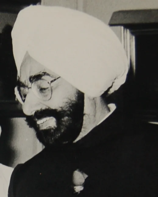 Giani Zail Singh in a turban and glasses, smiling, in a black-and-white photograph