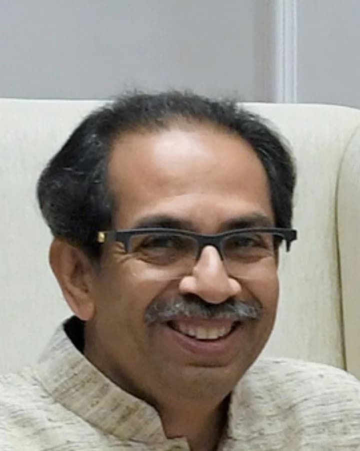 Uddhav Thackeray in spectacles and a light kurta, smiling